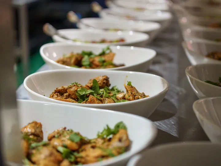Bowls of chicken curry garnished with coriander