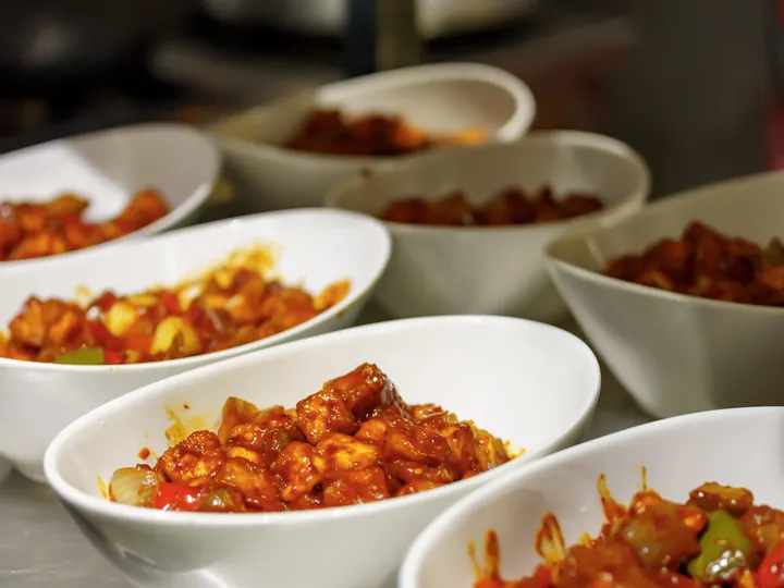 Bowls of Indo-Chinese style chicken ready to serve