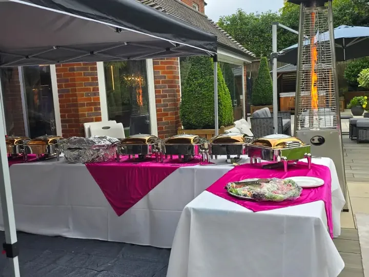Outdoor marquee catering set-up for a garden celebration