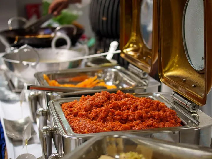 Indian sweets and sides laid out on the buffet